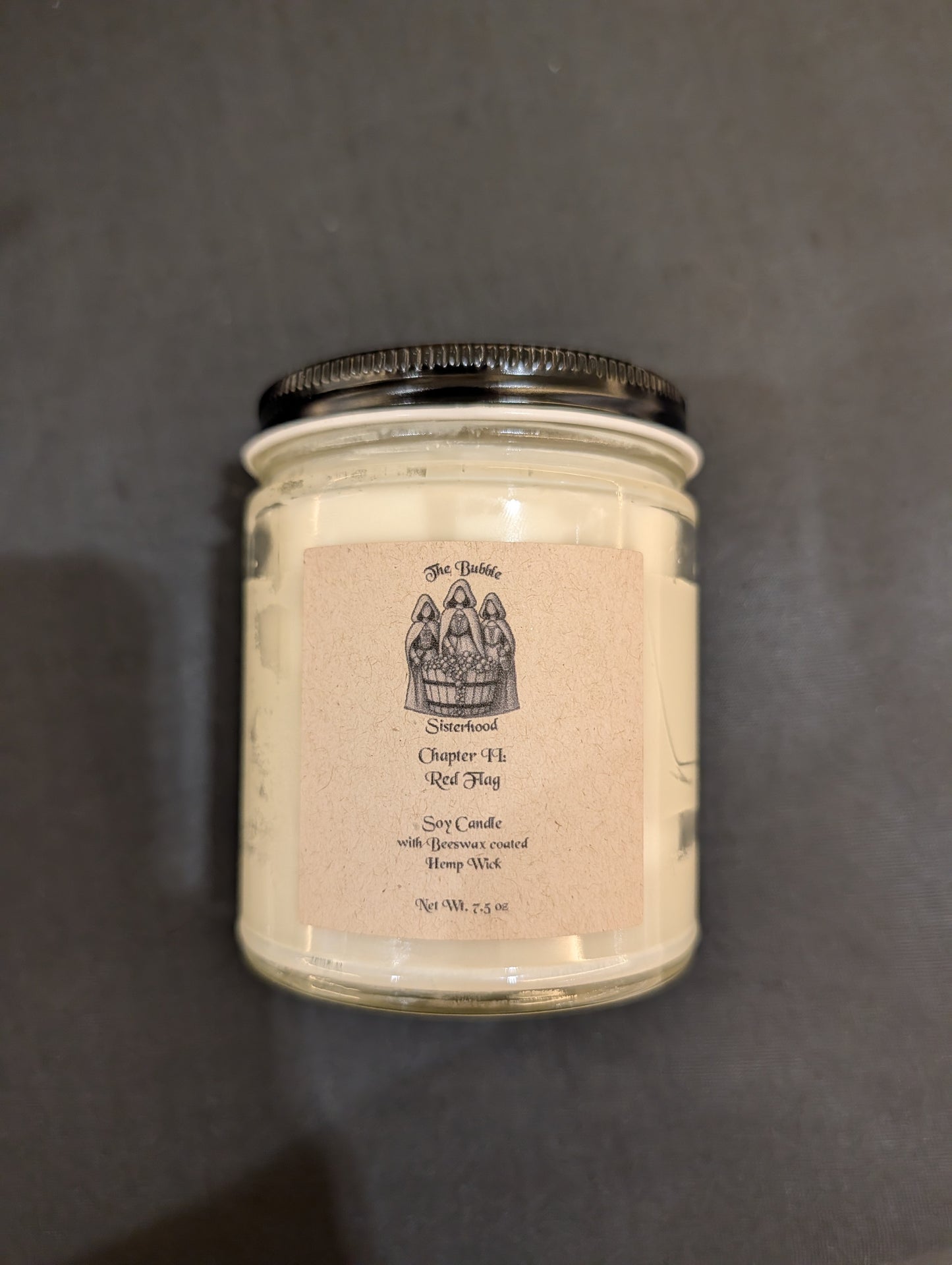 Chapter II: Red Flag soy candle in clear glass jar with black lid — white wax with brand label